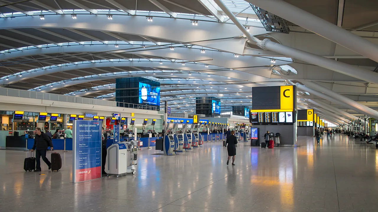Bright concourse and signs inside Heathrow Terminal 5