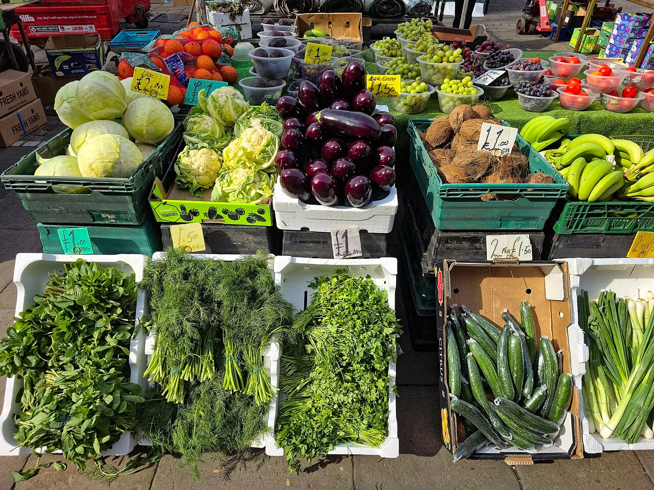 Colorful vegetables displayed at an outdoor market in Romford, London