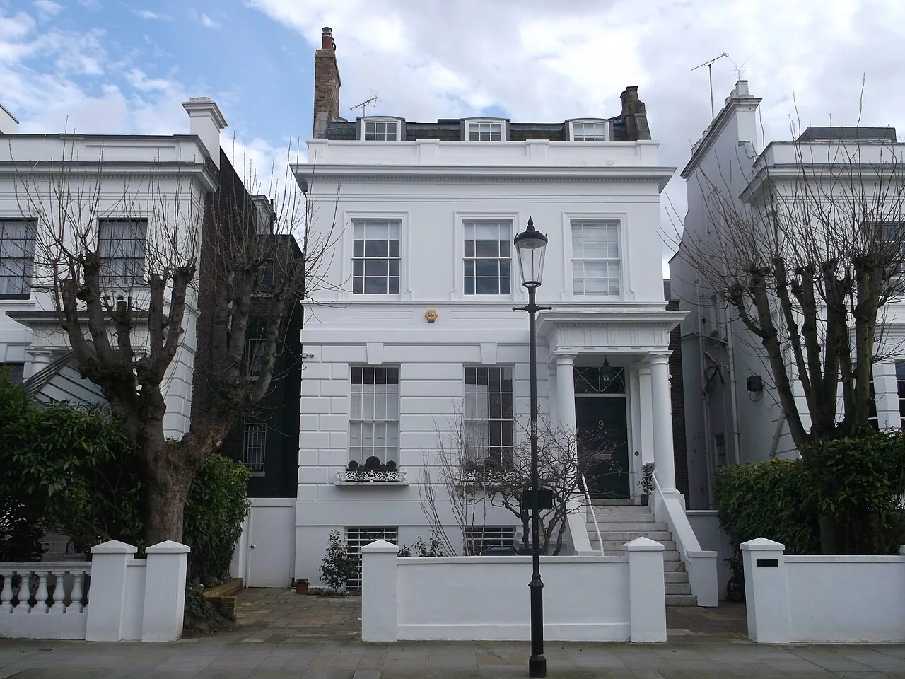 White residential facade at Dawson Place in Notting Hill, London